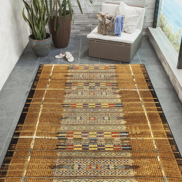 Mistana™ Augustus Southwestern Indoor / Outdoor Area Rug in Gold